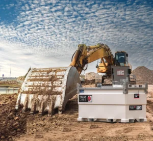 Western Global TransCube fuel storage tank with an open equipment cabinet beside an excavator at a construction site.